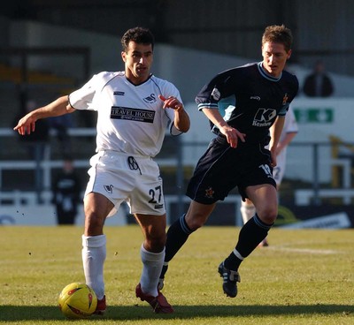 150203 - Swansea City v Cambridge United - Third Division - Swansea's Roberto Martinez looks to pass after getting around David Bridges