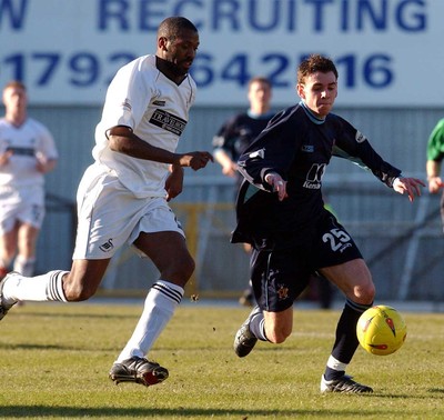 150203 - Swansea City v Cambridge United - Third Division - Swansea's John Williams tries to get past Tom Newey