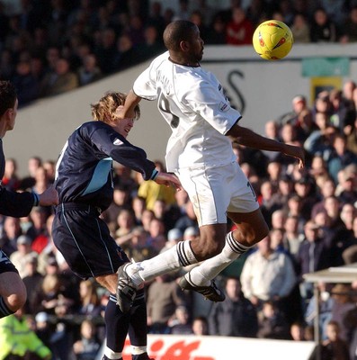 150203 - Swansea City v Cambridge United - Third Division - Swansea's John Williams takes a high ball from Warren Goodhind