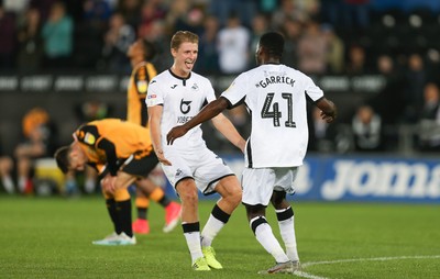 280819 - Swansea City v Cambridge United, Carabao Cup, Round 2 - Jordon Garrick of Swansea City celebrates with George Byers of Swansea City after scoring the fourth goal