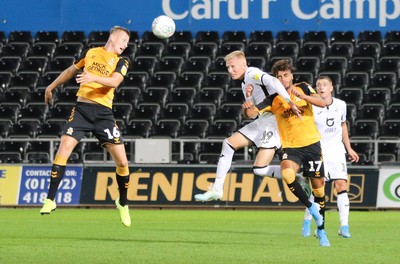 280819 - Swansea City v Cambridge United, Carabao Cup, Round 2 - Sam Surridge of Swansea City gets between Harry Darling of Cambridge United and Leon Davies of Cambridge United to compete for the ball