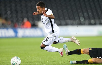 280819 - Swansea City v Cambridge United, Carabao Cup, Round 2 - Wayne Routledge of Swansea City is brought down by Jack Roles of Cambridge United