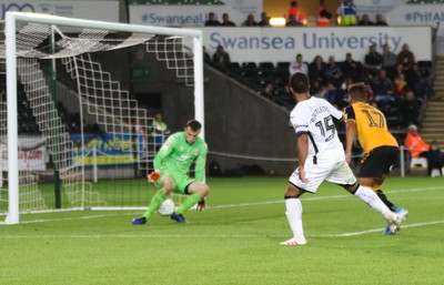 280819 - Swansea City v Cambridge United, Carabao Cup, Round 2 - Wayne Routledge of Swansea City puts the ball past Cambridge United goalkeeper Callum Burton to score Swansea's sixth goal