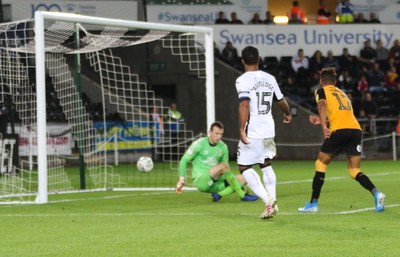 280819 - Swansea City v Cambridge United, Carabao Cup, Round 2 - Wayne Routledge of Swansea City puts the ball past Cambridge United goalkeeper Callum Burton to score Swansea's sixth goal