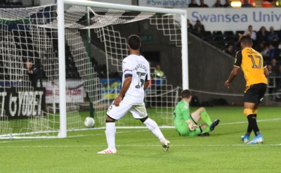 280819 - Swansea City v Cambridge United, Carabao Cup, Round 2 - Wayne Routledge of Swansea City puts the ball past Cambridge United goalkeeper Callum Burton to score Swansea's sixth goal