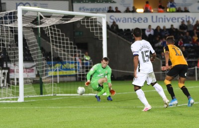 280819 - Swansea City v Cambridge United, Carabao Cup, Round 2 - Wayne Routledge of Swansea City puts the ball past Cambridge United goalkeeper Callum Burton to score Swansea's sixth goal