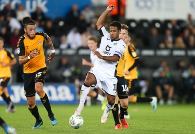 280819 - Swansea City v Cambridge United, Carabao Cup, Round 2 - Wayne Routledge of Swansea City takes on George Maris of Cambridge United and Louis John of Cambridge United