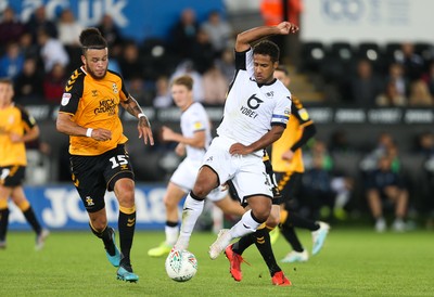 280819 - Swansea City v Cambridge United, Carabao Cup, Round 2 - Wayne Routledge of Swansea City takes on George Maris of Cambridge United and Louis John of Cambridge United