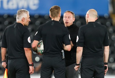 280819 - Swansea City v Cambridge United, Carabao Cup, Round 2 - Swansea City head coach Steve Cooper speaks to the match officials at the end of the match