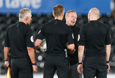 280819 - Swansea City v Cambridge United, Carabao Cup, Round 2 - Swansea City head coach Steve Cooper speaks to the match officials at the end of the match