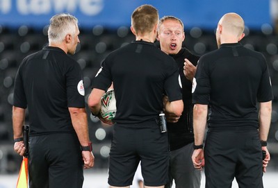 280819 - Swansea City v Cambridge United, Carabao Cup, Round 2 - Swansea City head coach Steve Cooper speaks to the match officials at the end of the match