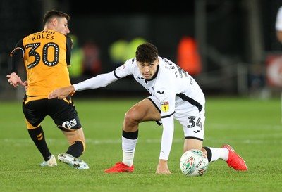 280819 - Swansea City v Cambridge United, Carabao Cup, Round 2 - Jack Evans of Swansea City looks to win the ball