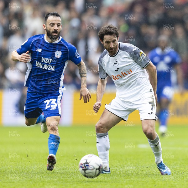 160324 - Swansea City v Cardiff City - Sky Bet Championship - Joe Allen of Swansea City in action against Manolis Siopis of Cardiff City