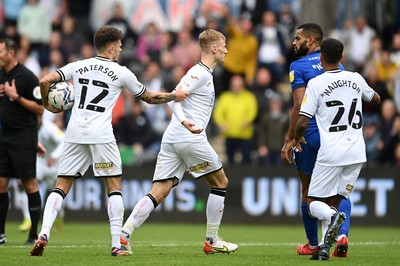 171021 - Swansea City v Cardiff City - Sky Bet Championship - Flynn Downes of Swansea City clashes with Curtis Nelson of Cardiff City 