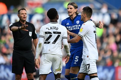 171021 - Swansea City v Cardiff City - Sky Bet Championship - Ethan Laird of Swansea City clashes with Aden Flint of Cardiff City 