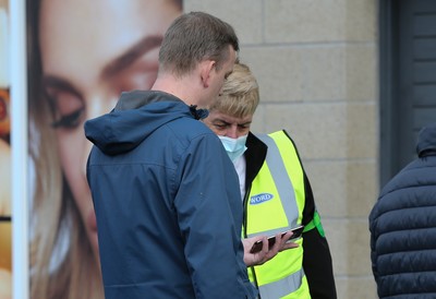 171021 - Swansea City v Cardiff City, EFL Sky Bet Championship - Checks are made on fans COVID Passes as they arrive at the ground, as it becomes a necessity for attendance at sporting events in Wales