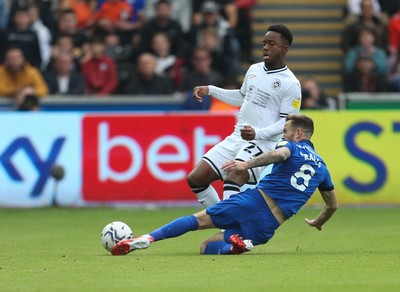 171021 - Swansea City v Cardiff City, EFL Sky Bet Championship - Ethan Laird of Swansea City is tackled by Joe Ralls of Cardiff City