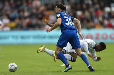 171021 - Swansea City v Cardiff City, EFL Sky Bet Championship - Ethan Laird of Swansea City is tackled by Ciaron Brown of Cardiff City