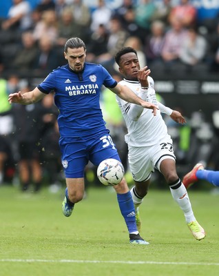 171021 - Swansea City v Cardiff City, EFL Sky Bet Championship - Ciaron Brown of Cardiff City holds off Ethan Laird of Swansea City