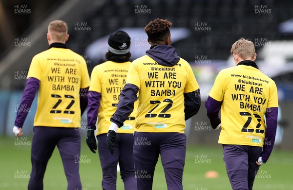 200321 - Swansea City v Cardiff City - SkyBet Championship - Swansea players wear t shirts during the warm up with �We are with you Bama� in support of Cardiff player Sol Bamba