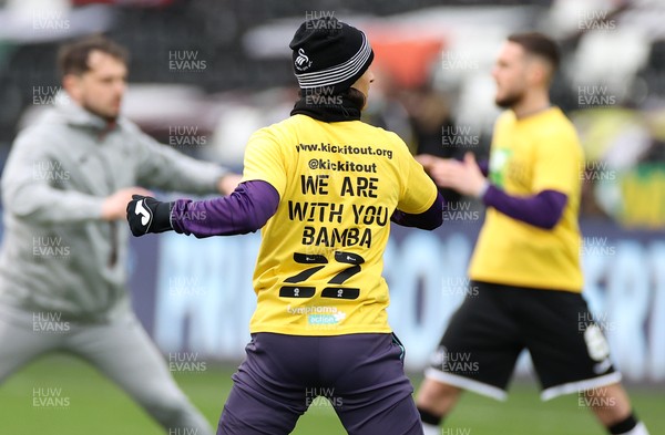 200321 - Swansea City v Cardiff City - SkyBet Championship - Swansea players wear t shirts during the warm up with �We are with you Bama� in support of Cardiff player Sol Bamba