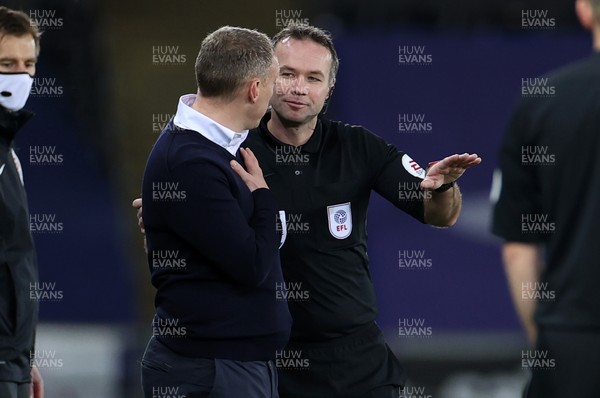 200321 - Swansea City v Cardiff City - SkyBet Championship - Referee Paul Tierney talks to Swansea City Manager Steve Cooper