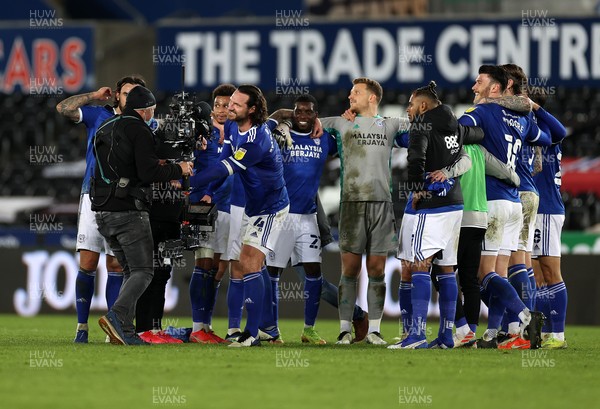 200321 - Swansea City v Cardiff City - SkyBet Championship - Sean Morrison of Cardiff City pushes the cameraman out of the team huddle
