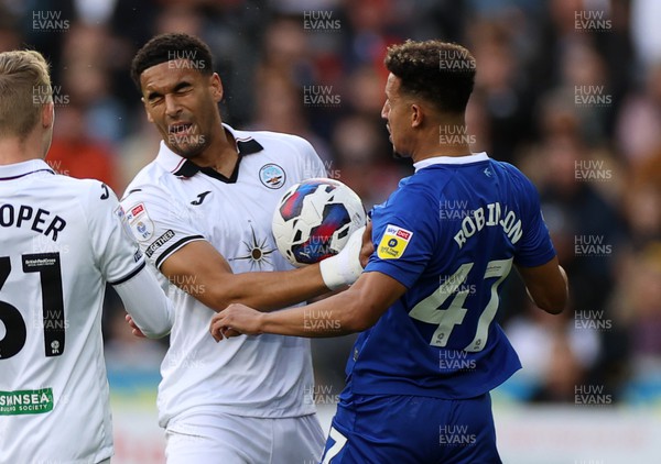 231022 - Swansea City v Cardiff City, South Wales Derby - SkyBet Championship - Callum Robinson of Cardiff City is given a red card for hitting Ben Cabango of Swansea City with the ball