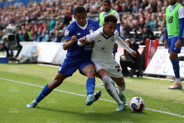 231022 - Swansea City v Cardiff City, South Wales Derby - SkyBet Championship - Matthew Sorinola of Swansea City is tackled by Andy Rinomhota of Cardiff City