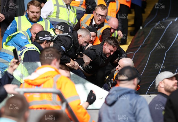 231022 - Swansea City v Cardiff City, South Wales Derby - SkyBet Championship - A Swansea fan is removed from the stands