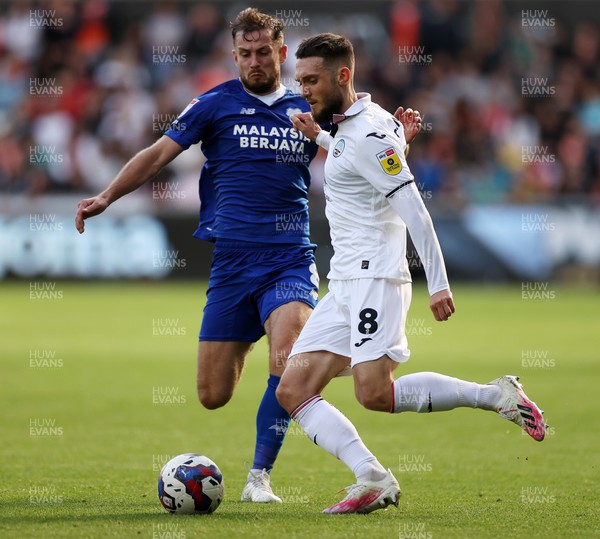231022 - Swansea City v Cardiff City, South Wales Derby - SkyBet Championship - Matt Grimes of Swansea City is tackled by Joe Ralls of Cardiff City
