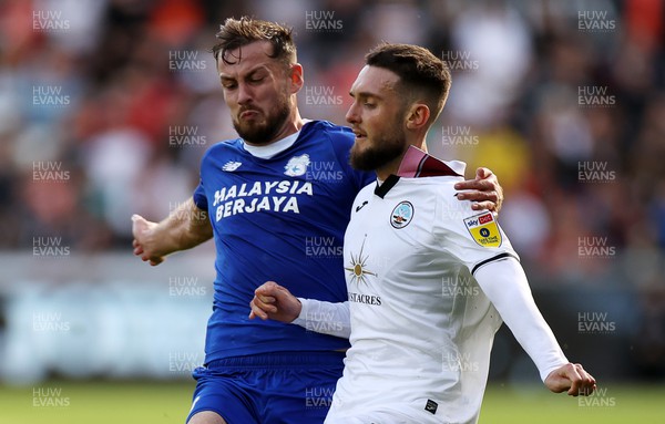 231022 - Swansea City v Cardiff City, South Wales Derby - SkyBet Championship - Matt Grimes of Swansea City is tackled by Joe Ralls of Cardiff City