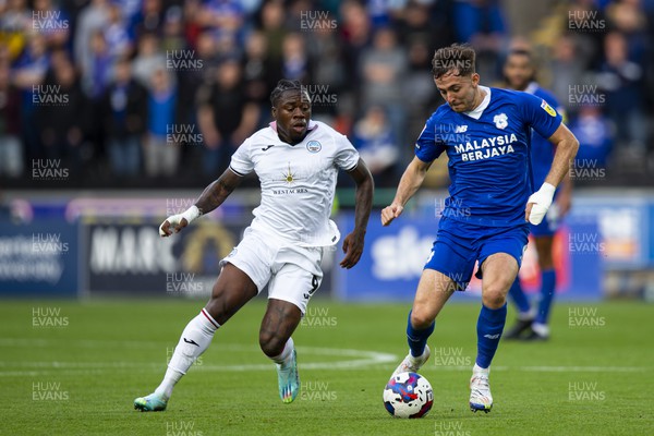 231022 - Swansea City v Cardiff City - Sky Bet Championship - Michael Obafemi of Swansea City in action against Ryan Wintle of Cardiff City