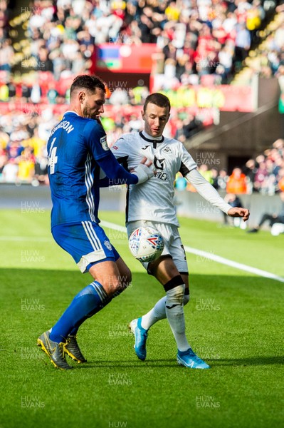 271019 - Swansea City v Cardiff City - SkyBet Championship - Sean Morrison of Cardiff City and Bersant Celina of Swansea City in action 