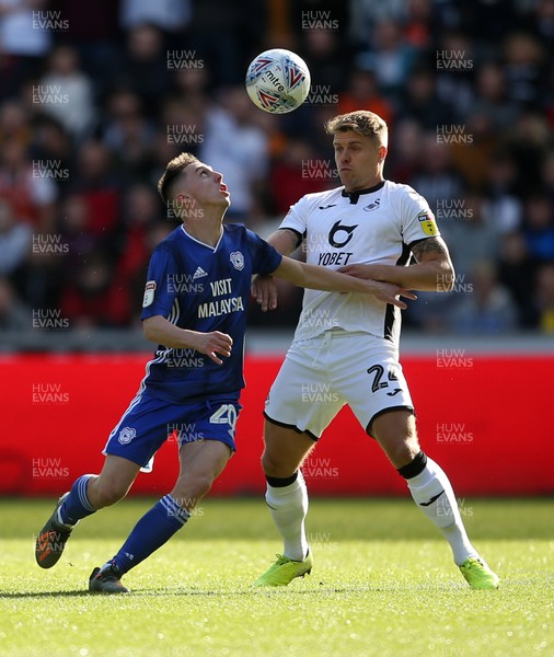 271019 - Swansea City v Cardiff City - SkyBet Championship - Gavin Whyte of Cardiff City is challenged by Jake Bidwell of Swansea City