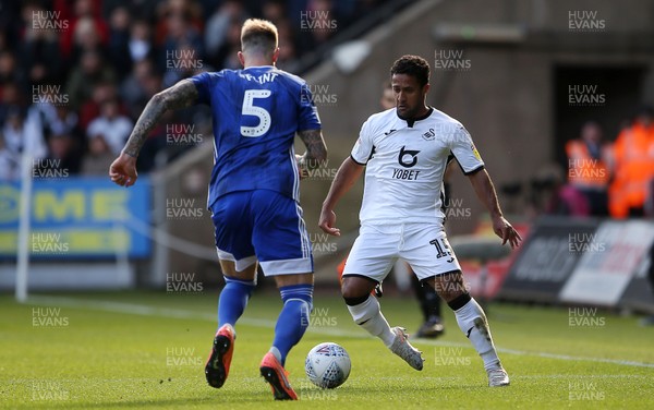 271019 - Swansea City v Cardiff City - SkyBet Championship - Wayne Routledge of Swansea City is challenged by Aden Flint of Cardiff City