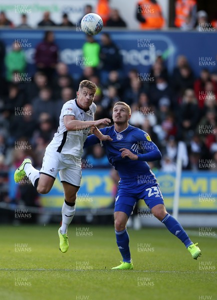 271019 - Swansea City v Cardiff City - SkyBet Championship - Jake Bidwell of Swansea City is challenged by Danny Ward of Cardiff City