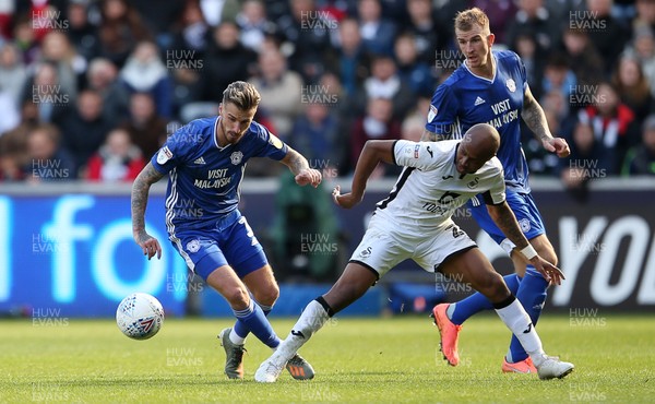 271019 - Swansea City v Cardiff City - SkyBet Championship - Joe Bennett of Cardiff City is tackled by Andre Ayew of Swansea City