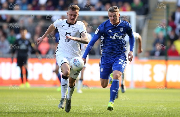 271019 - Swansea City v Cardiff City - SkyBet Championship - Ben Wilmot of Swansea City and Connor Roberts of Swansea City go for the ball