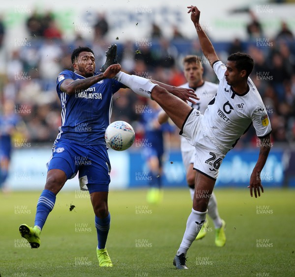 271019 - Swansea City v Cardiff City - SkyBet Championship - Nathaniel Mendez-Laing of Cardiff City and Kyle Naughton of Swansea City go for the ball