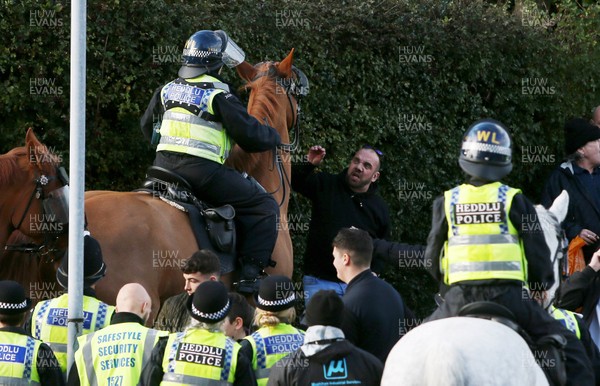271019 - Swansea City v Cardiff City - SkyBet Championship - A fan stands up to a police horse after the game