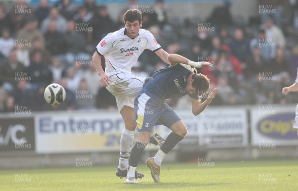 30.11.08 ... Swansea City v Cardiff City, Coca Cola Championship.  -  Swansea's Owain Tudur Jones tangles with Cardiff's Joe Ledley 