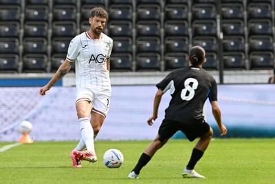010826 - Swansea City v CD Leganes - Preseason Friendly - Cameron Burgess of Swansea City is challenged by Yassine Kechta of Leganes