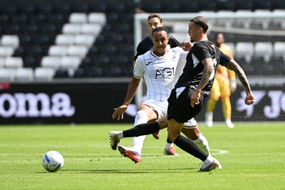 010826 - Swansea City v CD Leganes - Preseason Friendly - Adam Idah of Swansea City is challenged by Gonzalo Lopez of Leganes