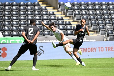 010826 - Swansea City v CD Leganes - Preseason Friendly - Josh Key of Swansea City is challenged by Yassine Kechta of Leganes