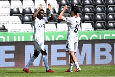 010826 - Swansea City v CD Leganes - Preseason Friendly - Jospeh Opoku of Swansea City celebrates scoring a goal with team mates