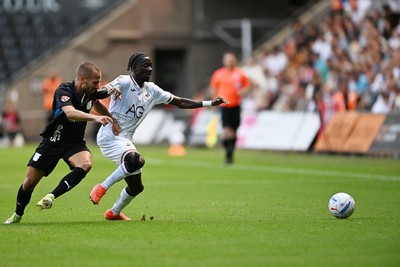 010826 - Swansea City v CD Leganes - Preseason Friendly - Moussa Yeo of Swansea City is challenged by Enric Franquesa of Leganes
