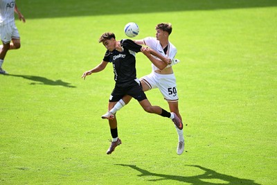 010826 - Swansea City v CD Leganes - Preseason Friendly - Carter Heywood of Swansea City challenges for the ball