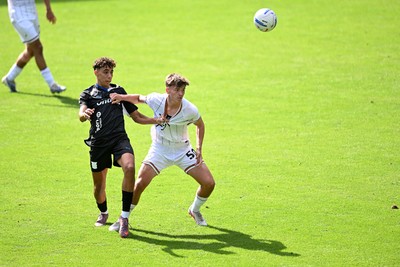 010826 - Swansea City v CD Leganes - Preseason Friendly - Carter Heywood of Swansea City challenges for the ball