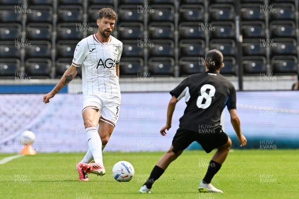 010826 - Swansea City v CD Leganes - Preseason Friendly - Cameron Burgess of Swansea City is challenged by Yassine Kechta of Leganes